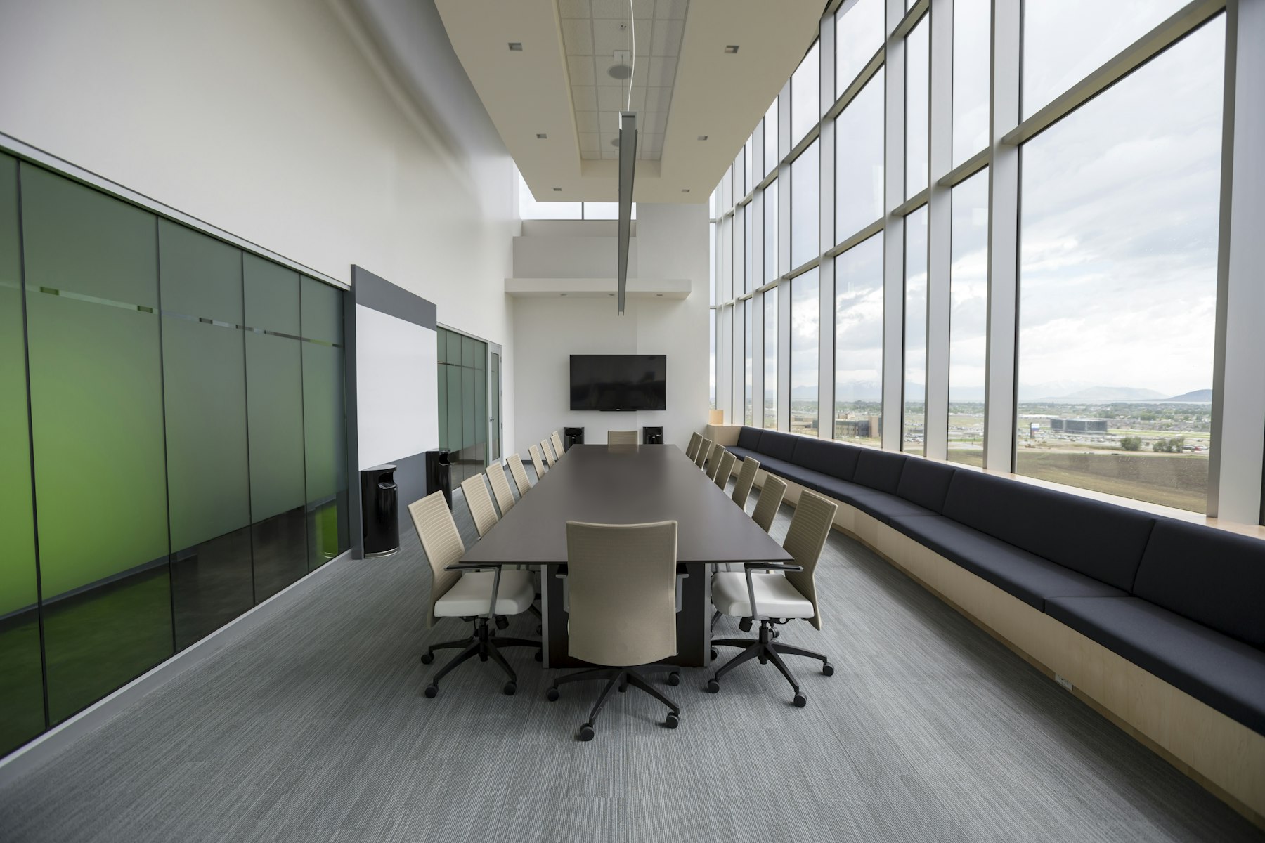 Family office boardroom with a long conference table and floor-to-ceiling windows, where governance decisions are made